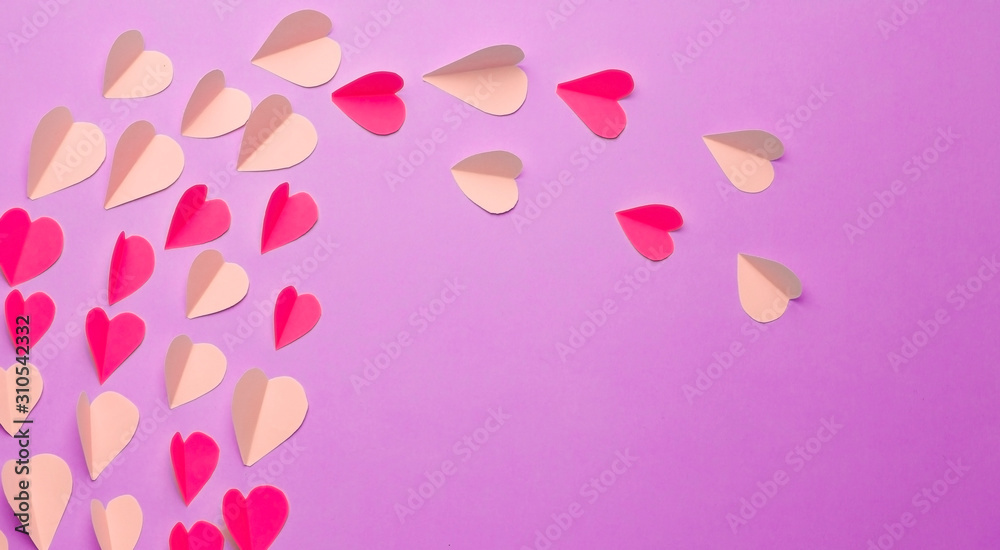 Love (Valentine's day) background or wedding background. Pink and red paper hearts on a blue pastel background. Love concept
