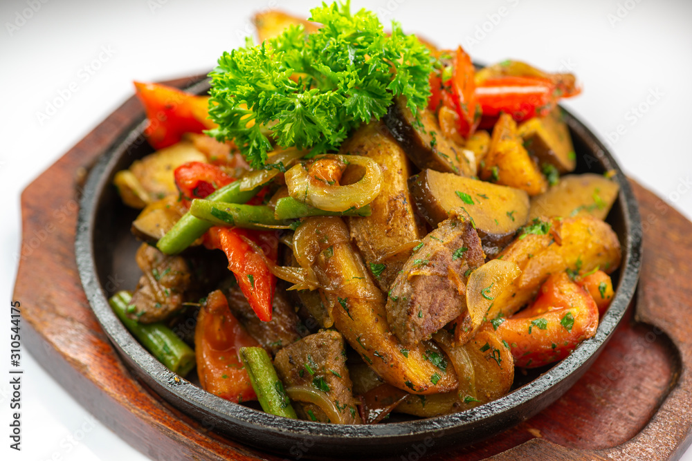 These are baked potatoes with vegetables and slices of juicy meat These are baked potatoes with vegetables and slices of juicy meat