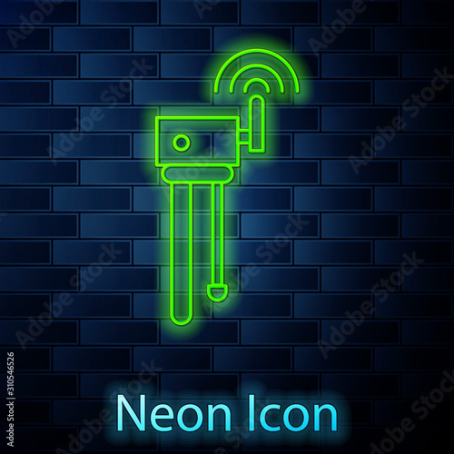 Glowing neon line Router and wi-fi signal symbol icon isolated on brick wall background. Wireless ethernet modem router. Computer technology internet. Vector Illustration