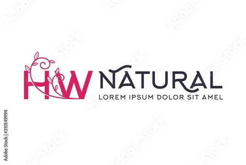 Creative pink floral wedding initial HW icon design with horizontal text. Vector logo template