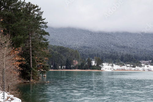 Lake in the mountains in winter on a sunny day (Greece)