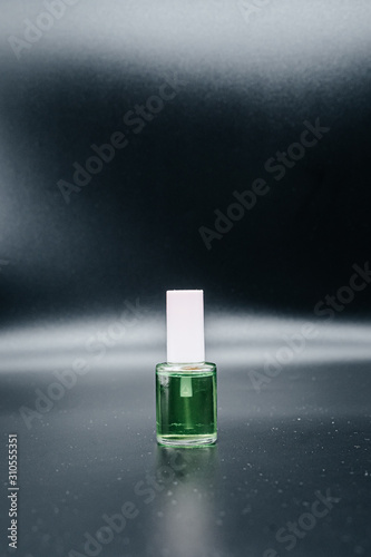 Nail Polish remover on a dark background close up