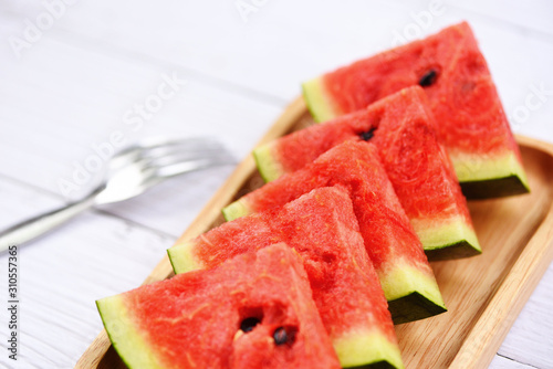 watermelon tropical fruit on wood tray - Fresh watermelon slice on white wooden background