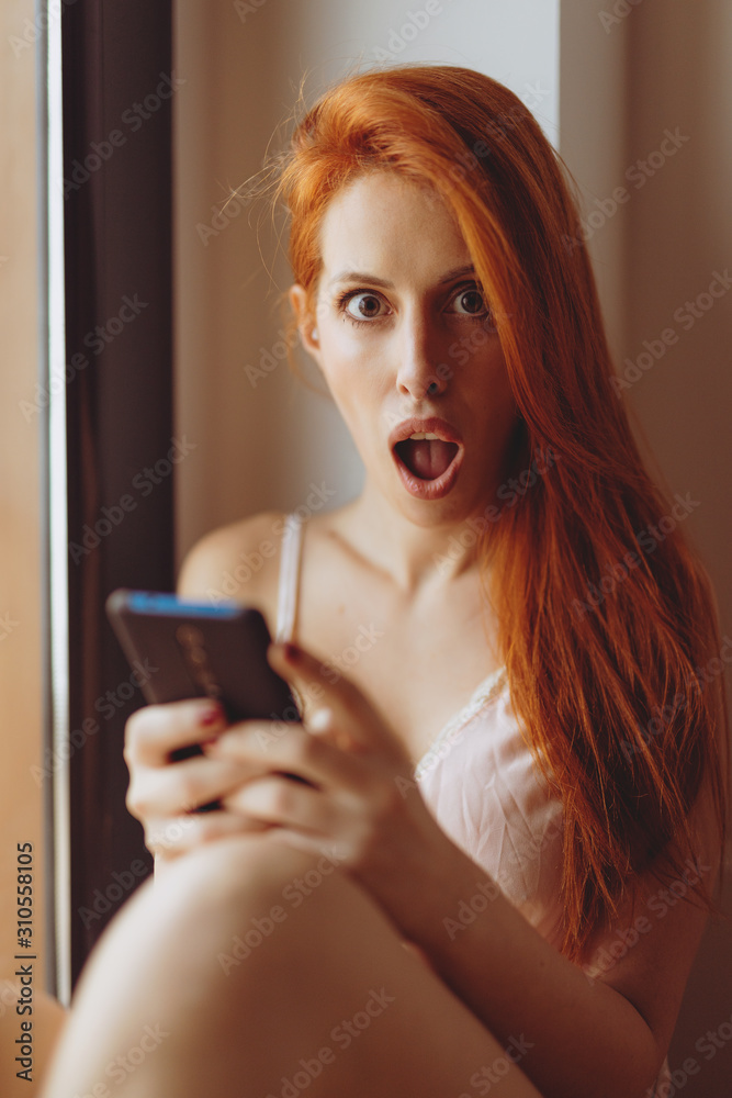 girl with mobile phone surprised girl with mobile phone surprised