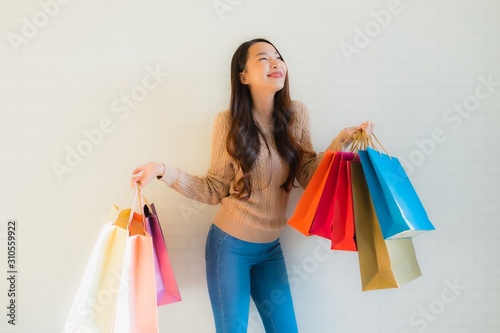 Portrait beautiful young asian women happy smile with shopping bag
