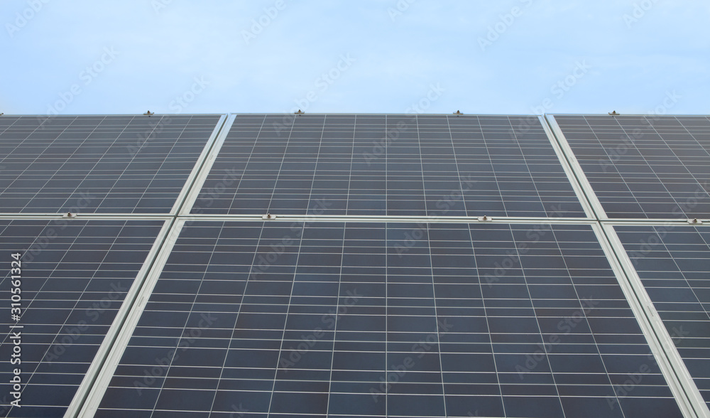 Close up shot of a solar panel array with blue sky Close up shot of a solar panel array with blue sky