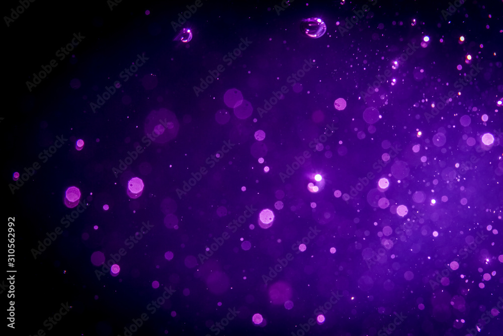 Abstract purple , violet bokeh on black Abstract purple , violet bokeh on black