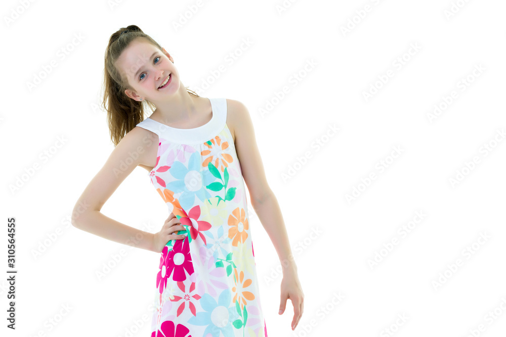 A little girl is watering a garden. A little girl is watering a garden.