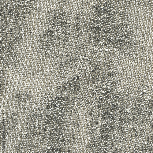 Macro photo texture of synthetic shiny silver fabric, closeup of a thread, shiny thread.