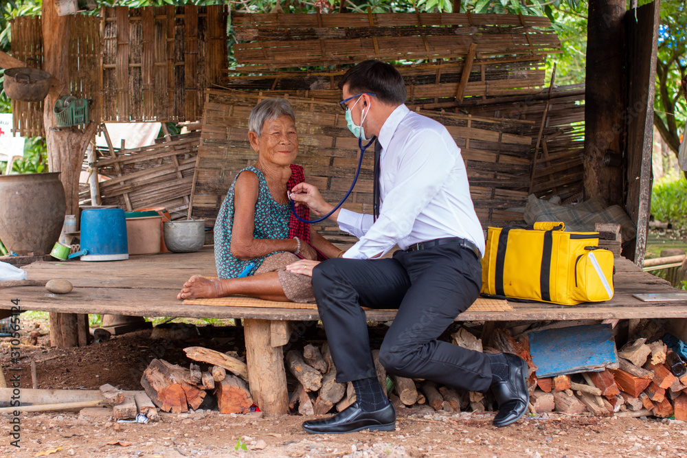 The doctor examined the patient's heart,Community Health and Development Hospital In Remote Areas Development Fund Concept. The doctor examined the patient's heart,Community Health and Development Hospital In Remote Areas Development Fund Concept.