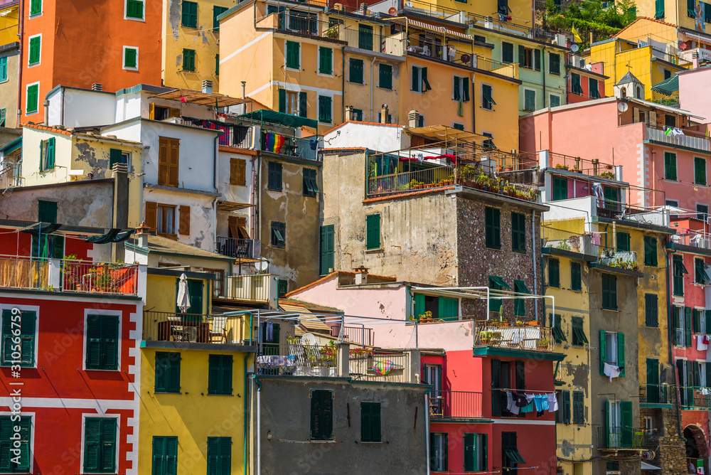 Traditional colorful ancient Italian architecture houses in Riomaggiore village, Cinque Terre