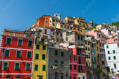 Traditional colorful ancient Italian architecture houses in Riomaggiore village, Cinque Terre