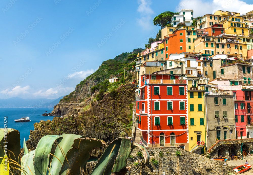 View at Riomaggiore village in Cinque Terre, Italy, with its traditional colorful houses and Ligurian Sea coast