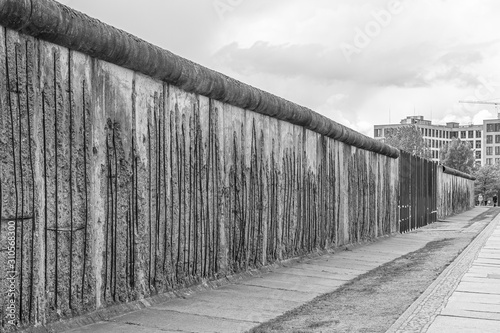 Part of old concrete Berlin Wall with steel bars as a monument in Berlin, Germany