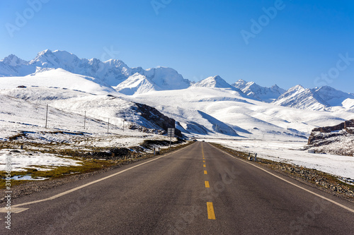Snow mountain and road in Xinjiang, China