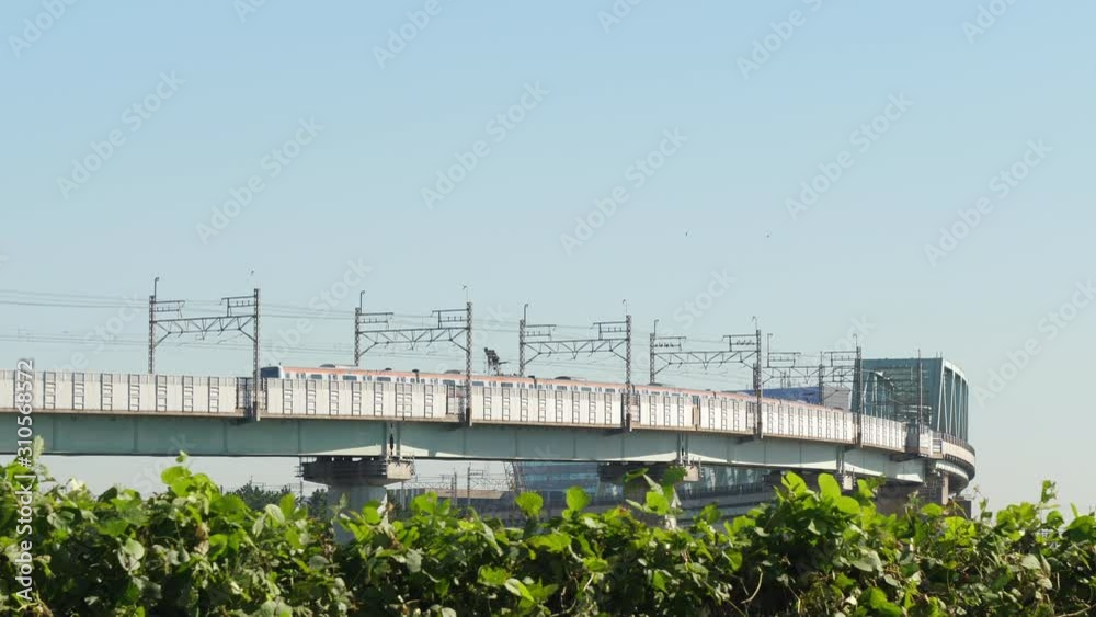 A train on the railtracks on the skyway in Tokyo