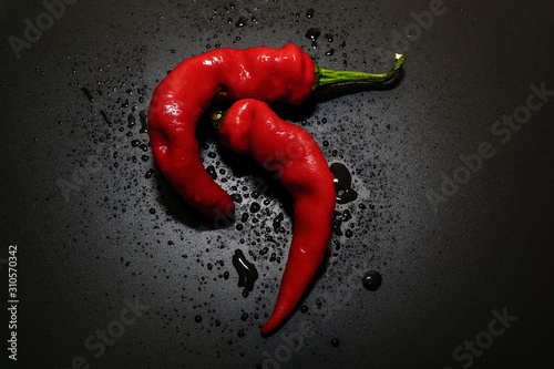 Chili peppers on a black background photo