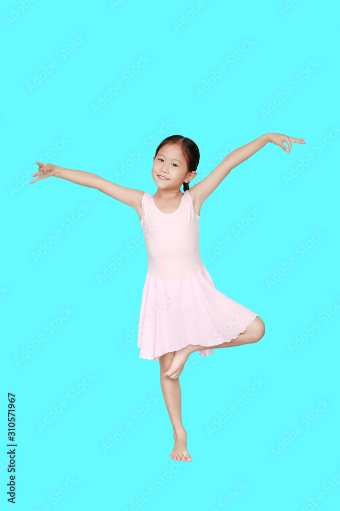 Beautiful little Asian child girl in pink tutu skirt isolated on cyan background. Children is studying ballet. Beautiful little Asian child girl in pink tutu skirt isolated on cyan background. Children is studying ballet.