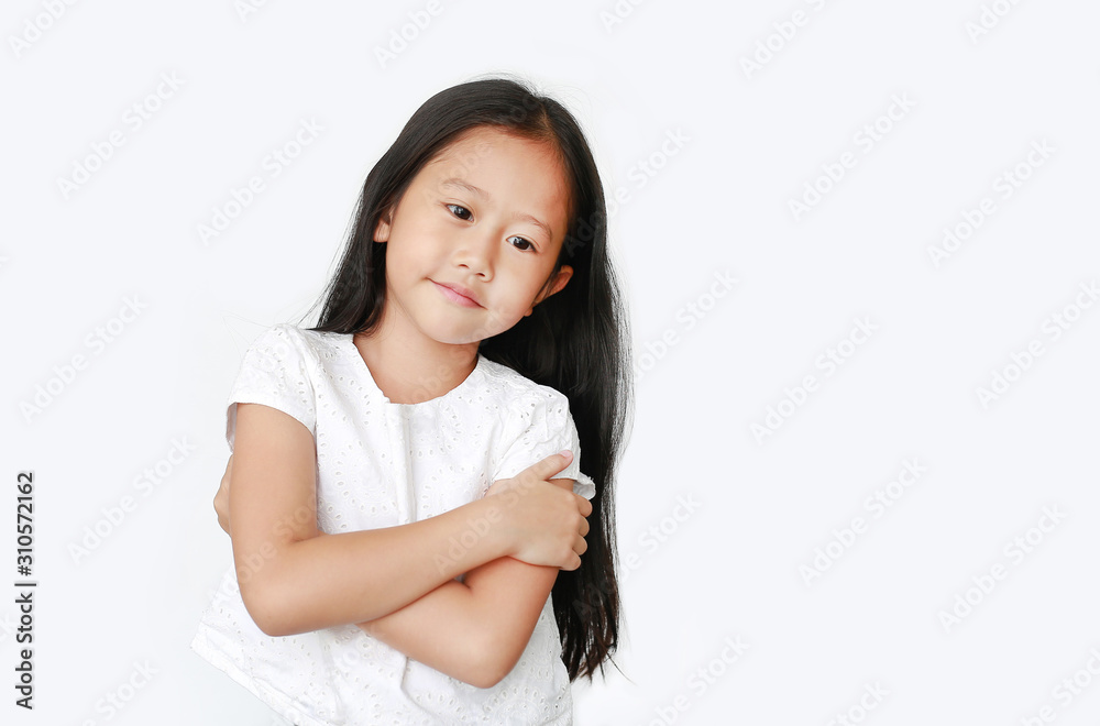 Confident little Asian child girl with expression cross one's arm and looking down isolated on white background with copy space. Cheerful kids concept. Confident little Asian child girl with expression cross one's arm and looking down isolated on white background with copy space. Cheerful kids concept.