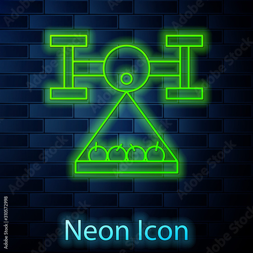 Glowing neon line Smart farm with drone control collects harvest icon isolated on brick wall background. Innovation technology for agricultural company. Vector Illustration