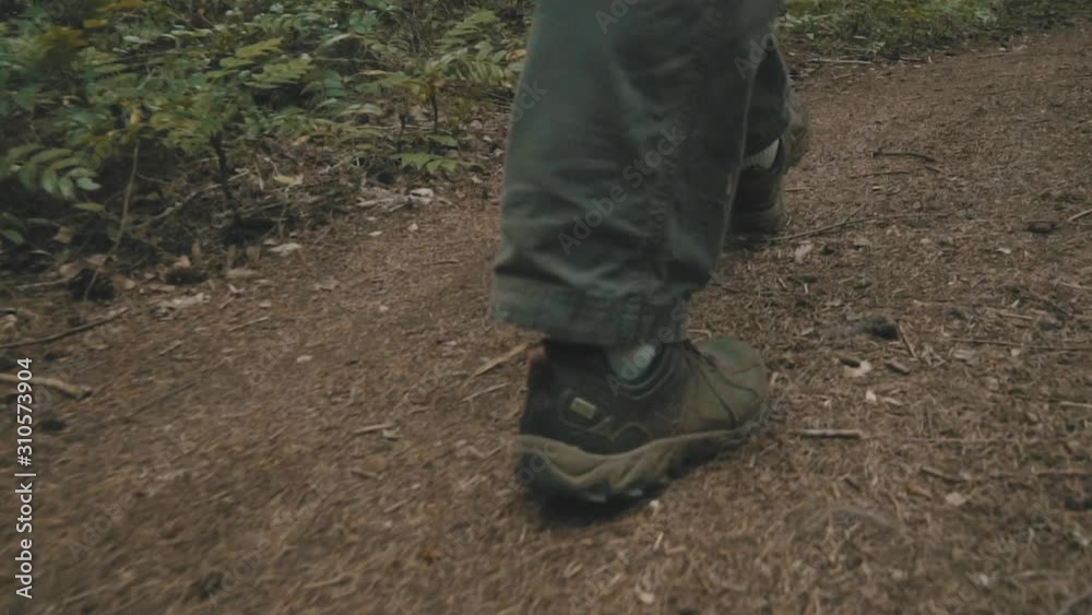 Close up shot of man hiking in the woods of the Pacific Northwest. Close up shot of man hiking in the woods of the Pacific Northwest.