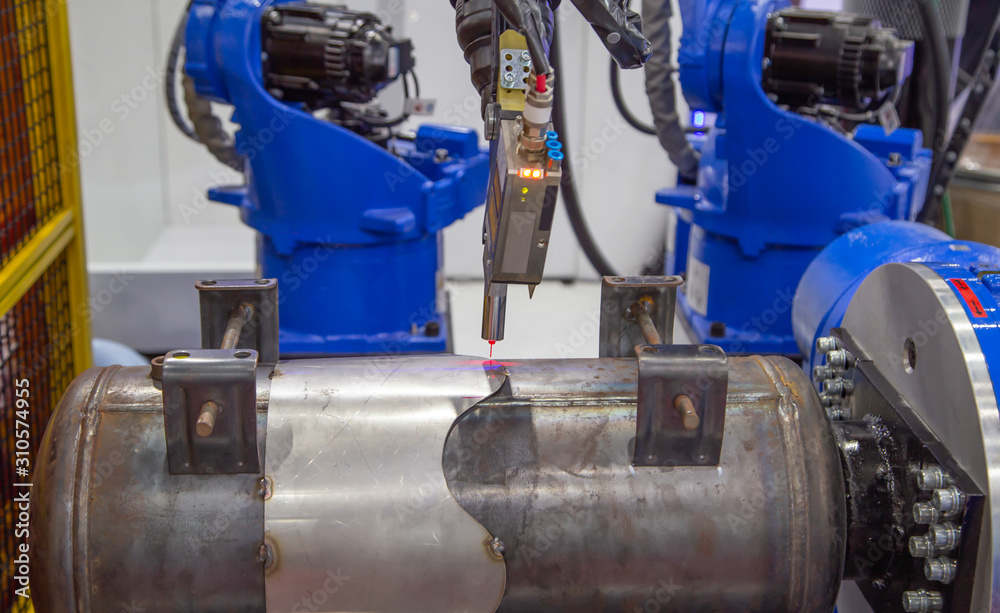 Seam tracking laser system for automated robot welding arm. Seam tracking laser system for automated robot welding arm.