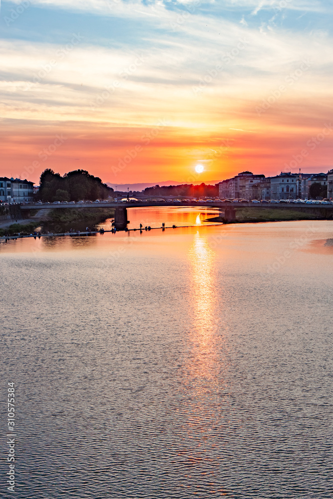 Vertical Crop Fiery Red Sun Setting on the Arno River in Florence