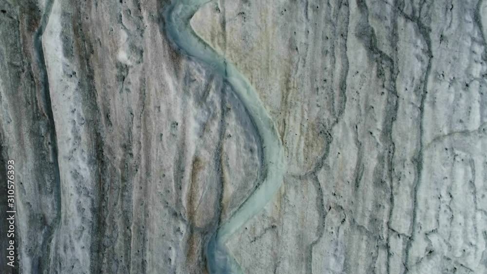 Drone fly upwards above melt water of glacial river on Aktru glacier tongue Drone fly upwards above melt water of glacial river on Aktru glacier tongue