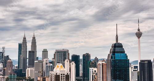 Photography Panoramic view of Kuala Lumpur city downtown with it’s skyscrapers during the cloudy weather