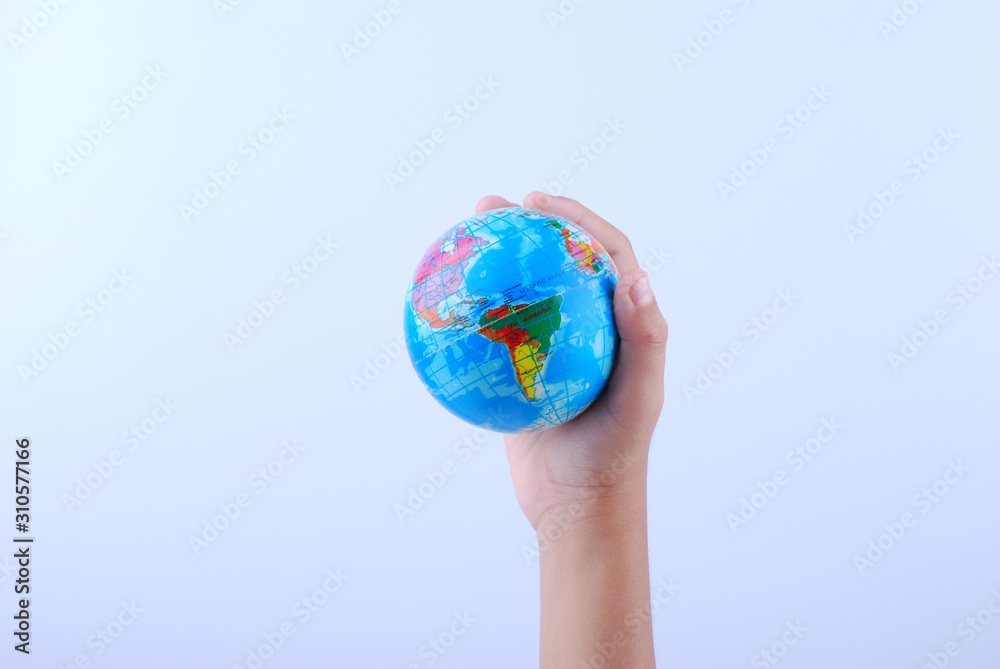 Hand holding earth globe on white background Hand holding earth globe on white background