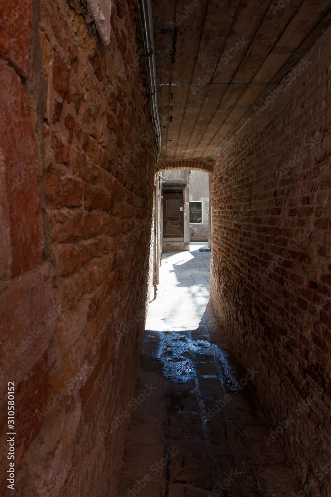 Old Brick Tunnel-Like Alley in Venice Italy