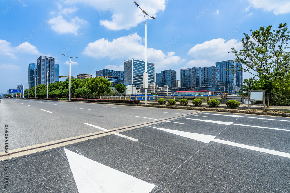 empty road and modern office buildings. empty road and modern office buildings.