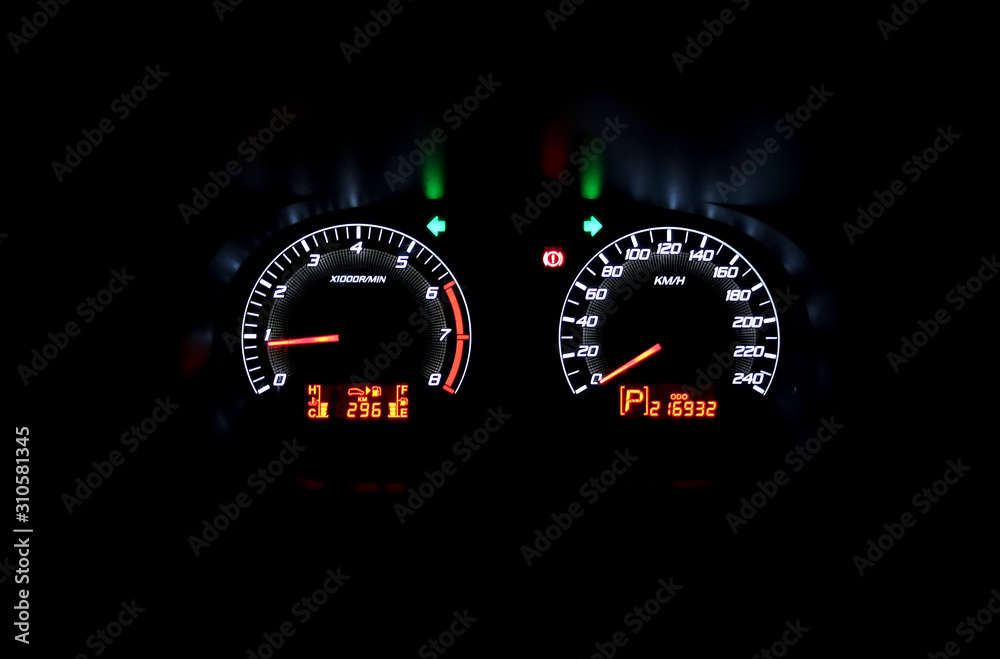 Colourful Car speedometer panel at night