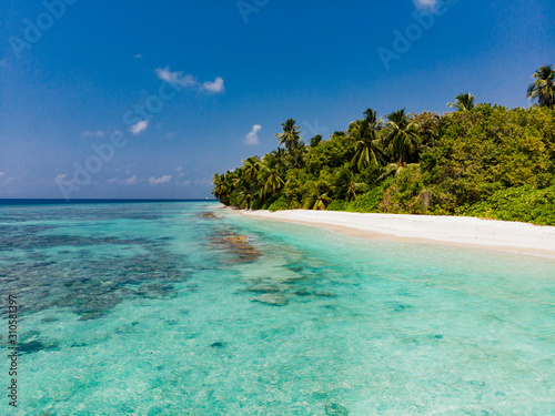 Pristine tropical beach with blue water and white sand © Zstock
