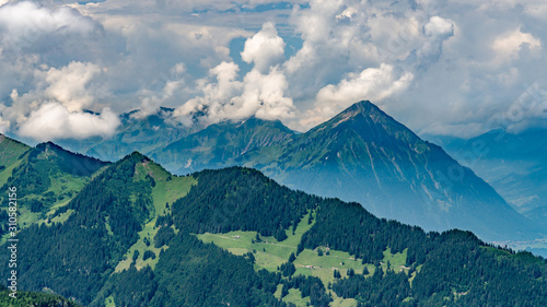 Switzerland, Panoramic view on green Alps and Niesen peak from Schynige Platte