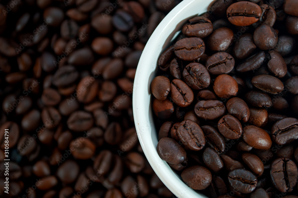 close-up coffee bean in whie cup and background close-up coffee bean in whie cup and background