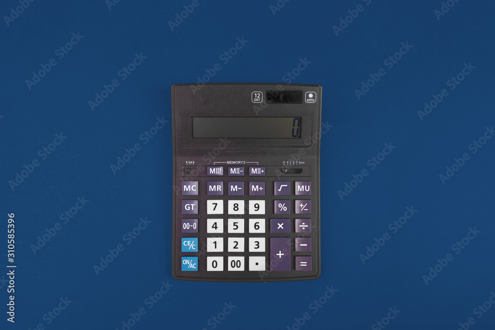 Top view of a calculator isolated on classic blue Top view of a calculator isolated on classic blue