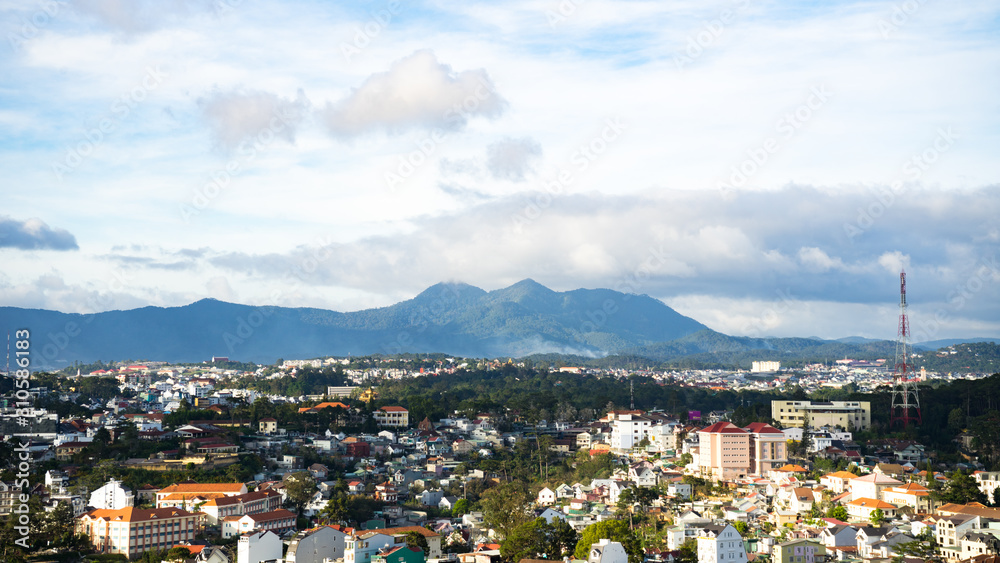 Cityscape of Dalat, Vietnam.Beautiful landscape view for mountains and buildings.Beautiful tiny houses.Da lat city in the blue sky background