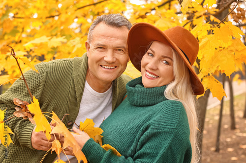 Happy mature couple in autu...