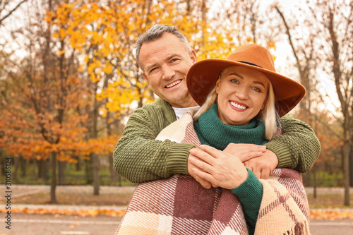 Happy mature couple in autu...