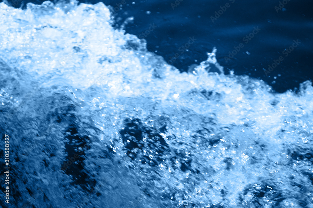 Classic blue 2020. Gradient color palette. Splashing waves on the water. Blue water background. Classic blue 2020. Gradient color palette. Splashing waves on the water. Blue water background.