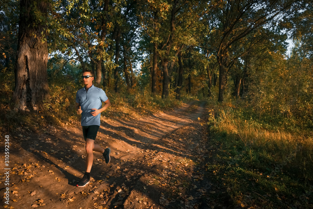 Fototapeta premium Man jogging in park. Running.