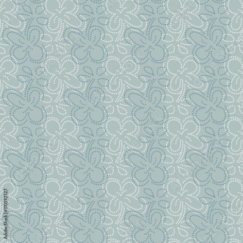A seamless vector pattern with dotted loral shapes in pale blue colors. Decorative elegant surface print design. Great for backgrounds  greeting cards and fabrics.