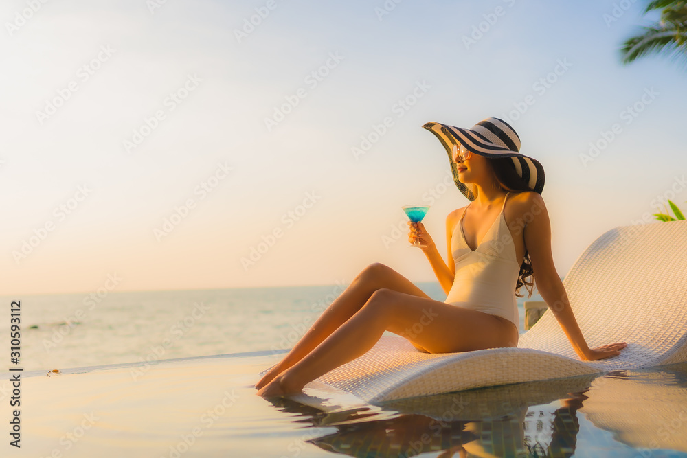 Portrait beautiful young asian women happy smile relax around outdoor swimming pool Portrait beautiful young asian women happy smile relax around outdoor swimming pool