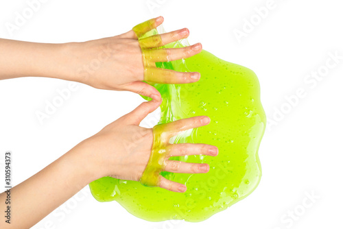 Green slime toy in woman hand isolated on white.