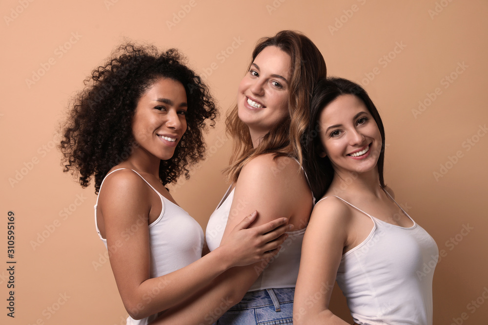Obraz premium Group of women with different body types on beige background
