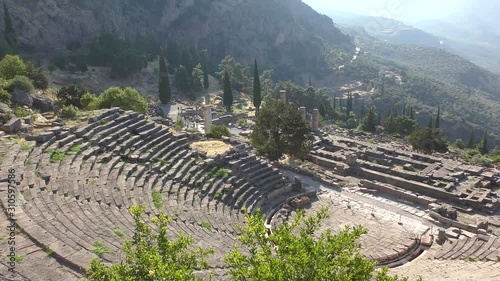 Ancient theatre of Delphi with temple of Apollo , panoramic view from above