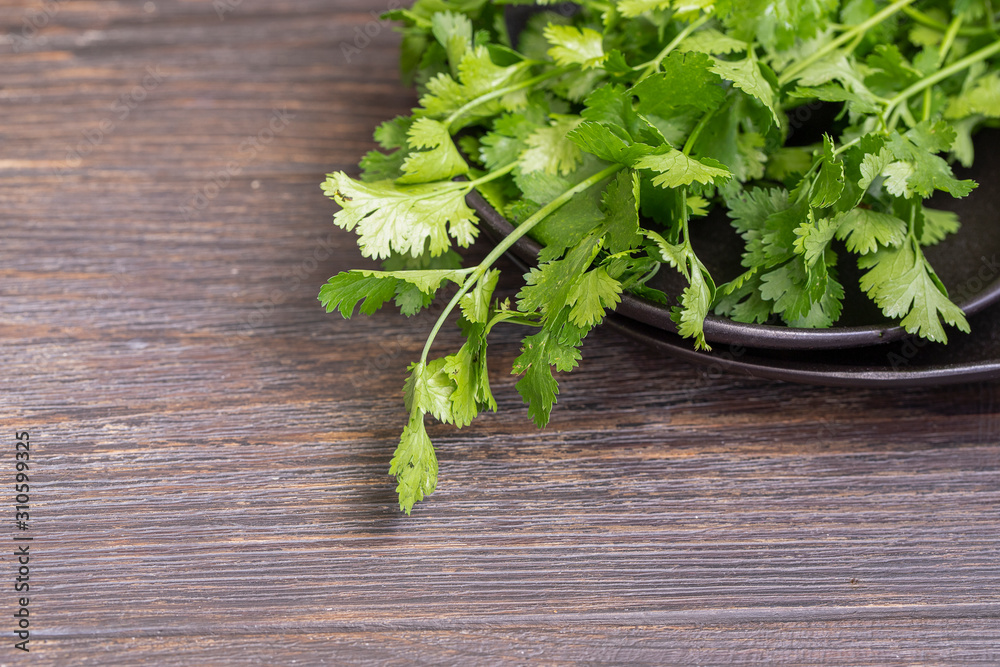 Fresh parsley leaves on wooden background for wallpaper or texture. Fresh parsley leaves on wooden background for wallpaper or texture.