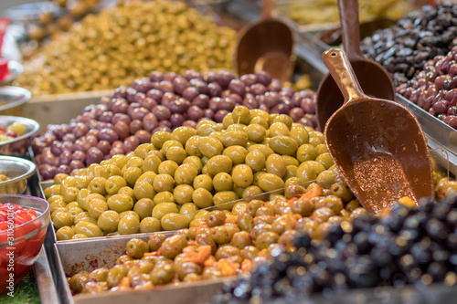 Olives. Of all varieties and in all shapes! Blacks, greens, bigs, little ones, Syrians, Arabs, bloody, conquered, and skulls. Kosher Food, Mahane Yehuda Market, Jerusalem, Israel.
