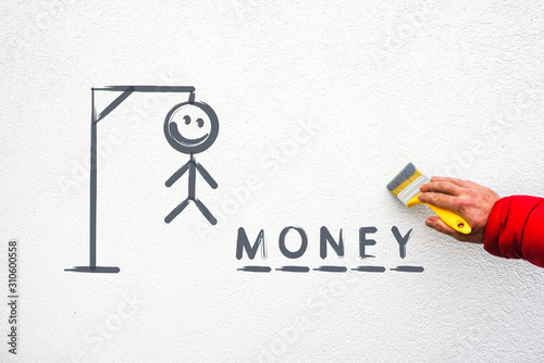 Bilde på lerret word money,  hangman traditional game on wall and hand with paint brush